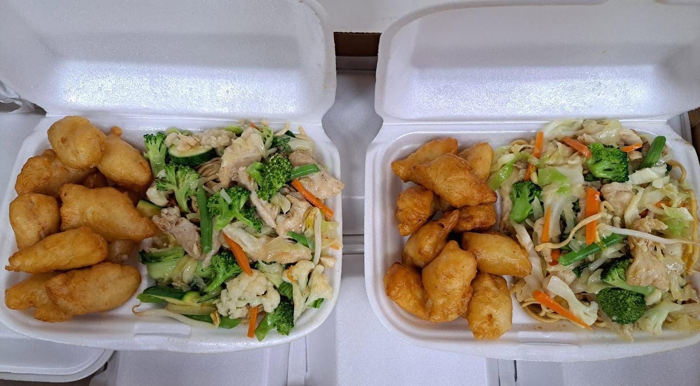 Sweet and sour chicken with stir-fry takeaway boxes from Hua Lien
